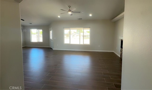17995 Seaforth St, Hesperia, CA 92345 - unfurnished living room with ceiling fan, dark wood-style flooring, a fireplace, and recessed lighting