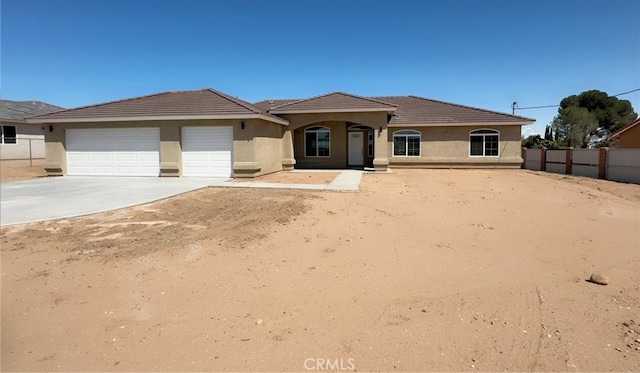 17995 Seaforth St, Hesperia, CA 92345 - view of front of property with stucco siding, an attached garage, concrete driveway, and a tile roof