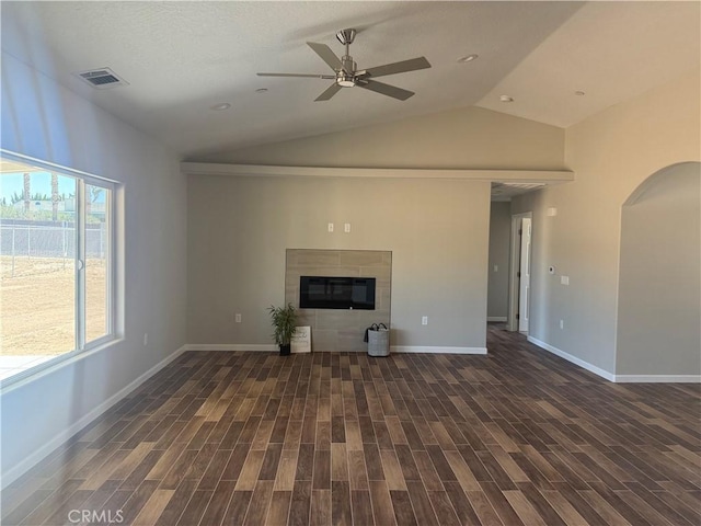 17995 Seaforth St, Hesperia, CA 92345 - unfurnished living room with a ceiling fan, lofted ceiling, arched walkways, wood finished floors, and a fireplace