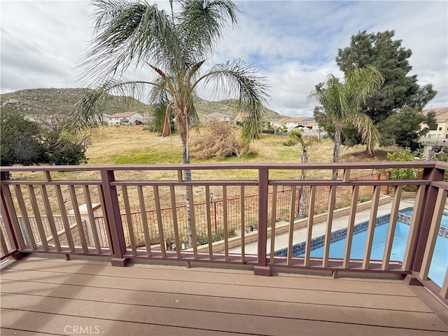 deck with a fenced in pool