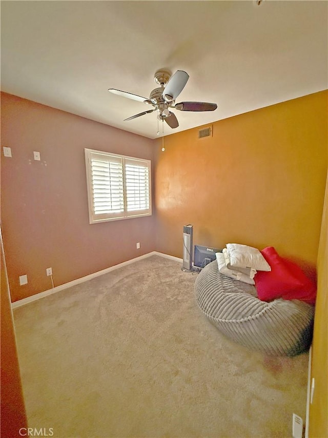 unfurnished bedroom featuring baseboards, ceiling fan, carpet flooring, and visible vents