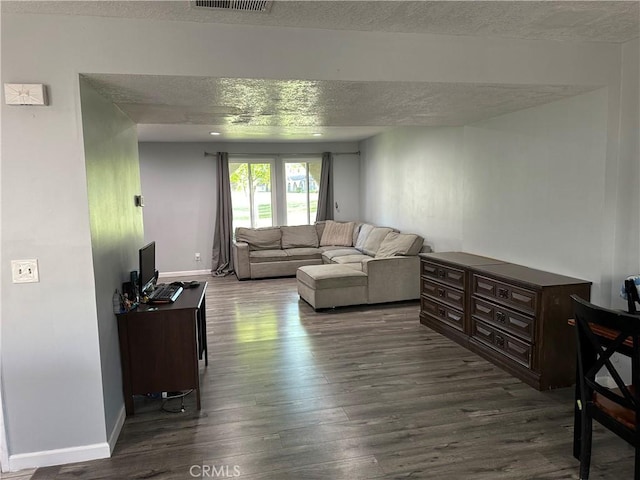 25260 Avenida Dorena, Newhall, CA 91321 - living area with a textured ceiling, dark wood-style floors, and baseboards