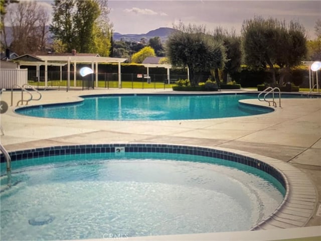 25260 Avenida Dorena, Newhall, CA 91321 - community pool featuring a patio, a mountain view, and fence