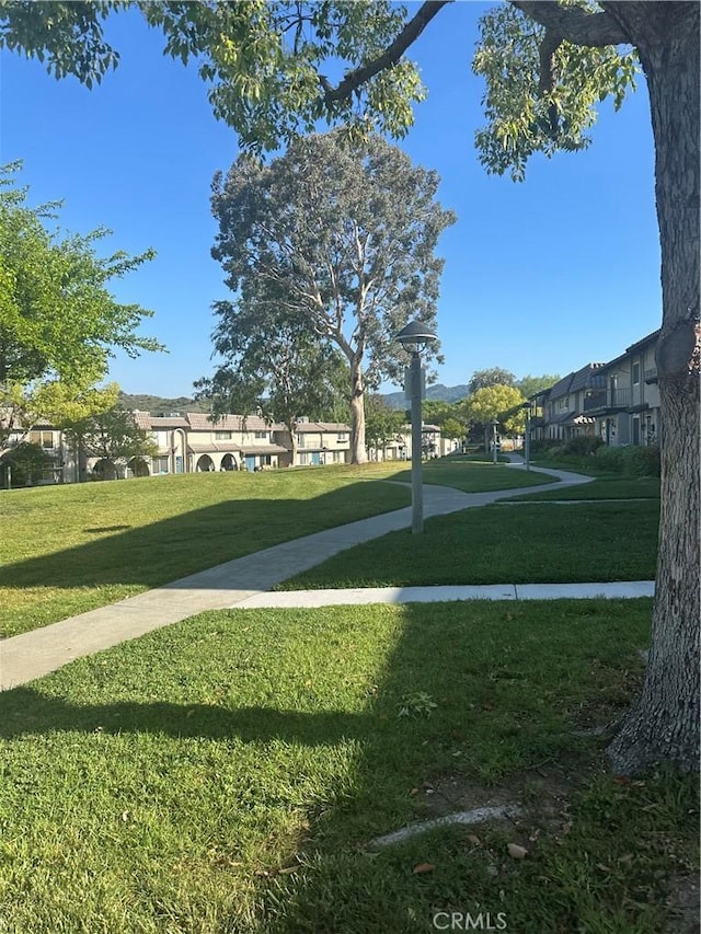 25260 Avenida Dorena, Newhall, CA 91321 - view of home's community with a residential view and a lawn