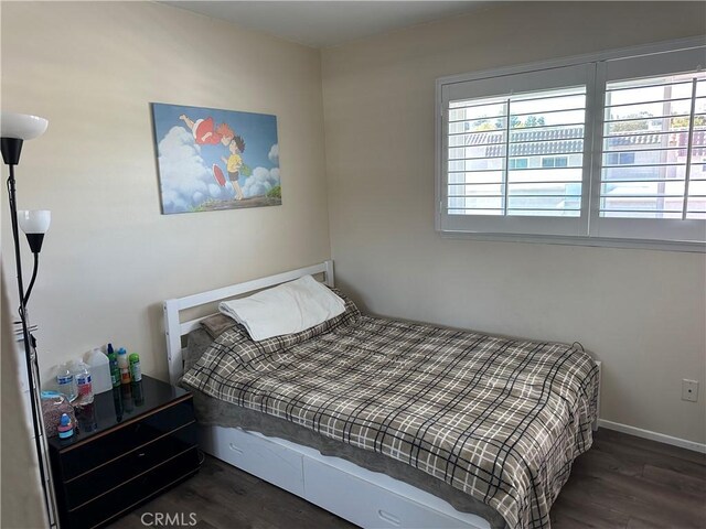 25260 Avenida Dorena, Newhall, CA 91321 - bedroom featuring baseboards, dark wood-style floors, and multiple windows