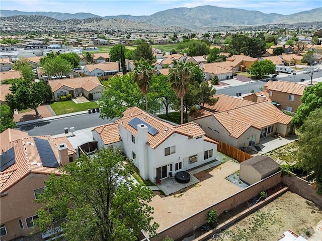 aerial view featuring a mountain view and a residential view