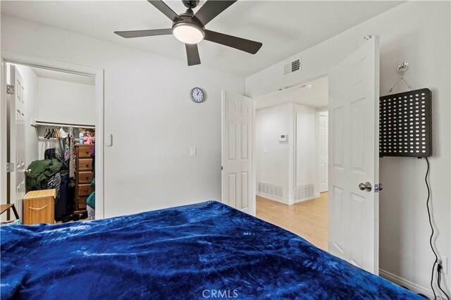 1555 Berkshire Dr, Palmdale, CA 93551 - unfurnished bedroom with ceiling fan, visible vents, and wood finished floors