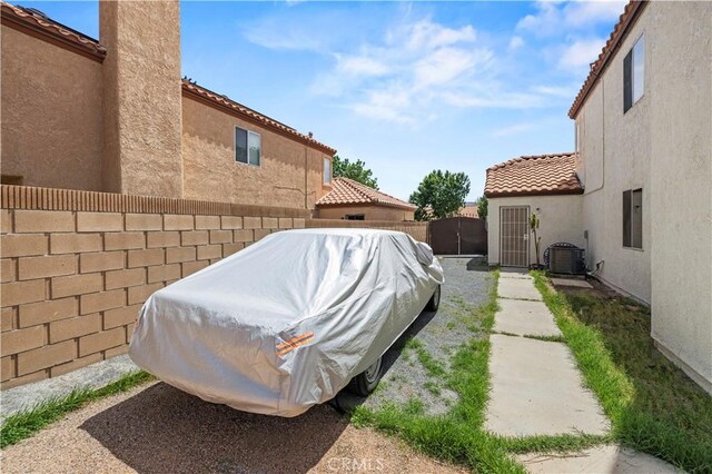 1555 Berkshire Dr, Palmdale, CA 93551 - exterior space featuring central air condition unit and a fenced backyard