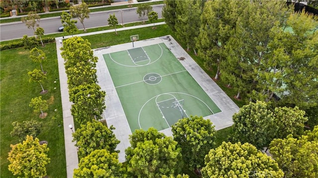 view of sport court featuring community basketball court and a yard