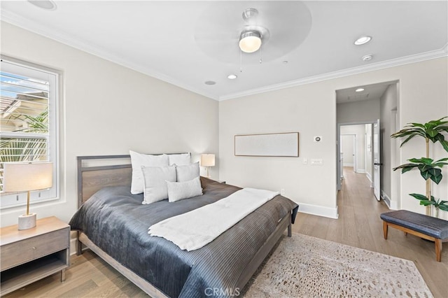 bedroom featuring baseboards, recessed lighting, light wood finished floors, and ornamental molding