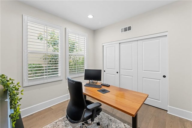 office with recessed lighting, baseboards, visible vents, and light wood-style flooring