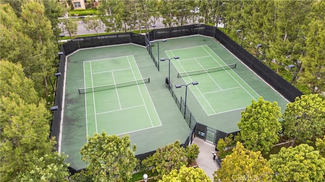 view of sport court with fence
