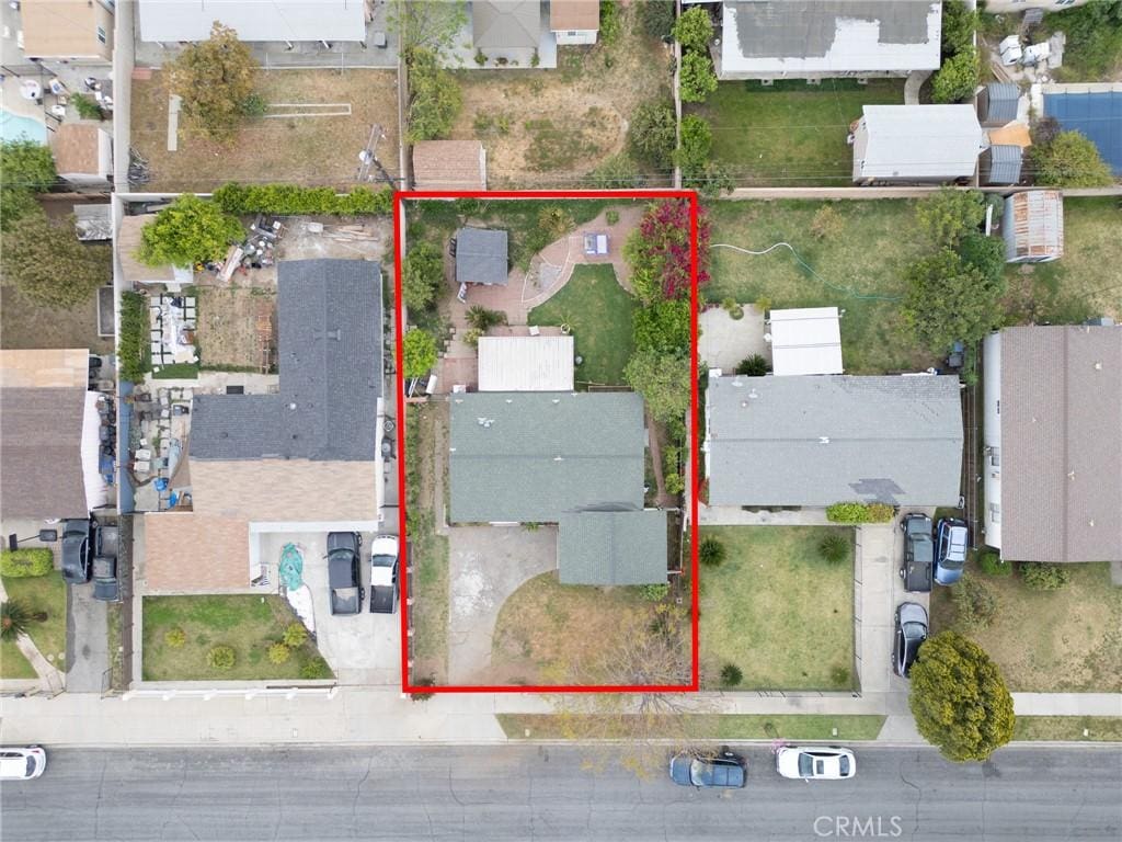 birds eye view of property with a residential view