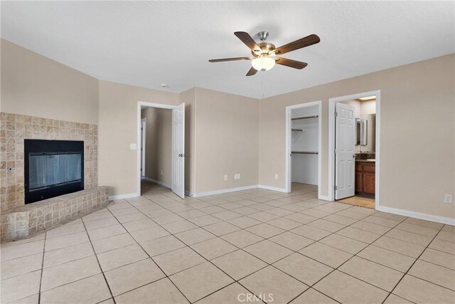 11569 Arroyo Ave, Hesperia, CA 92345 - unfurnished living room featuring a ceiling fan, baseboards, and light tile patterned floors