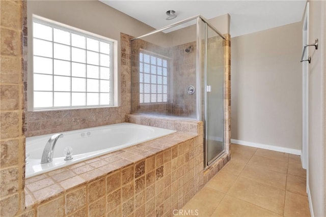 11569 Arroyo Ave, Hesperia, CA 92345 - full bathroom featuring a garden tub, a stall shower, tile patterned floors, and baseboards