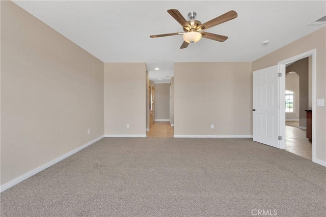11569 Arroyo Ave, Hesperia, CA 92345 - empty room with ceiling fan, arched walkways, light colored carpet, baseboards, and recessed lighting