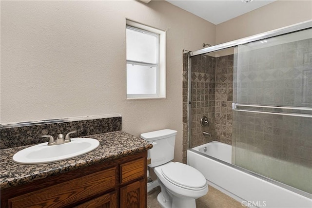 11569 Arroyo Ave, Hesperia, CA 92345 - bathroom with toilet, vanity, and bath / shower combo with glass door