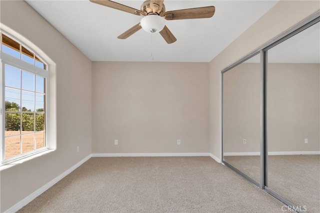 11569 Arroyo Ave, Hesperia, CA 92345 - unfurnished bedroom with carpet flooring, baseboards, a closet, and a ceiling fan