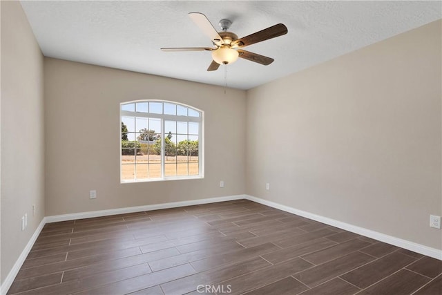 11569 Arroyo Ave, Hesperia, CA 92345 - spare room with wood tiled floors, ceiling fan, baseboards, and a textured ceiling