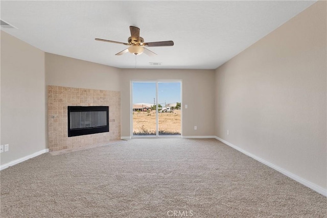 11569 Arroyo Ave, Hesperia, CA 92345 - unfurnished living room with ceiling fan, a fireplace, baseboards, and carpet