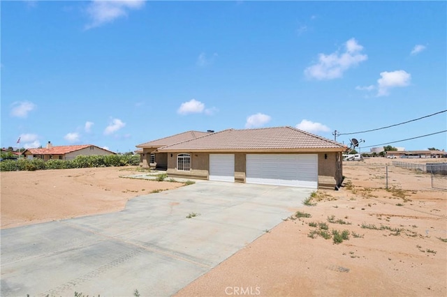 11569 Arroyo Ave, Hesperia, CA 92345 - single story home with an attached garage, concrete driveway, stucco siding, and a tile roof