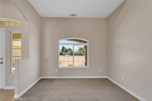 11569 Arroyo Ave, Hesperia, CA 92345 - carpeted spare room featuring baseboards and arched walkways