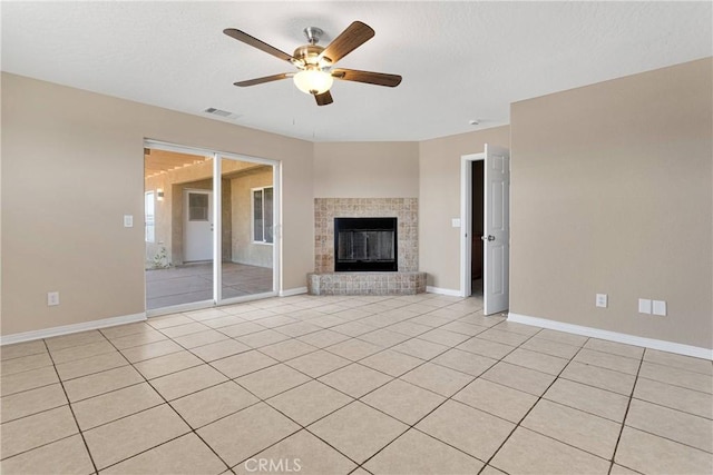 11569 Arroyo Ave, Hesperia, CA 92345 - unfurnished living room with a ceiling fan, baseboards, a brick fireplace, and light tile patterned floors