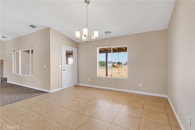 11569 Arroyo Ave, Hesperia, CA 92345 - unfurnished room with a chandelier, light tile patterned floors, and baseboards