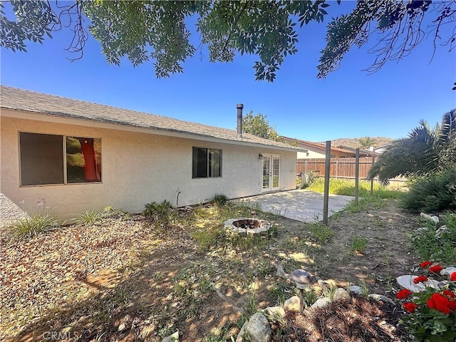 14585 Long View Dr, Fontana, CA 92337 - rear view of property with stucco siding and a patio