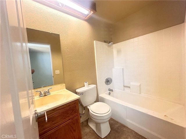 bathroom featuring vanity, a textured wall, toilet, tile patterned floors, and  shower combination