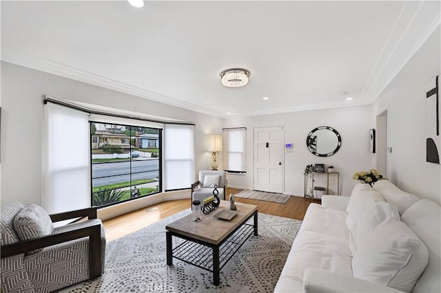 living area with ornamental molding, recessed lighting, and wood finished floors