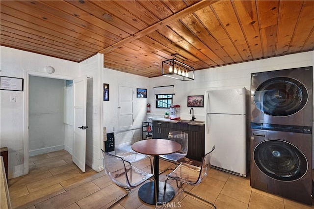 laundry room with laundry area, a sink, wood ceiling, and stacked washer / drying machine