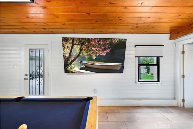 recreation room with wooden ceiling, wood walls, tile patterned floors, and billiards