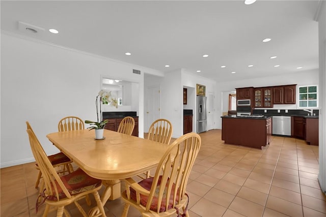 dining room with recessed lighting, crown molding, light tile patterned floors, and visible vents
