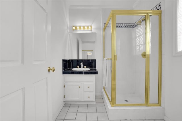 bathroom with vanity, tile patterned flooring, and a stall shower