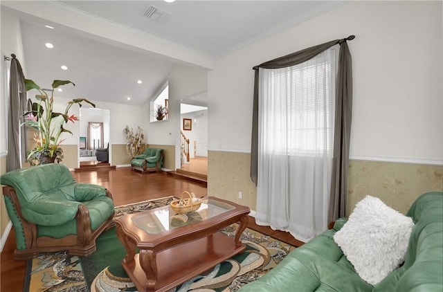 living room featuring visible vents, recessed lighting, crown molding, and wood finished floors