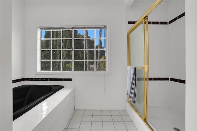 full bathroom featuring baseboards, tile patterned floors, an enclosed shower, and a bath