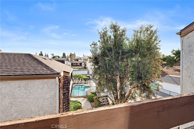 950 W Lambert Rd Unit 9, La Habra, CA 90631 - details featuring fence, a downspout, stucco siding, and gutters