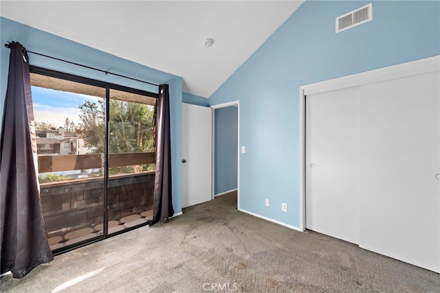 950 W Lambert Rd Unit 9, La Habra, CA 90631 - unfurnished bedroom featuring access to exterior, visible vents, vaulted ceiling, a closet, and carpet
