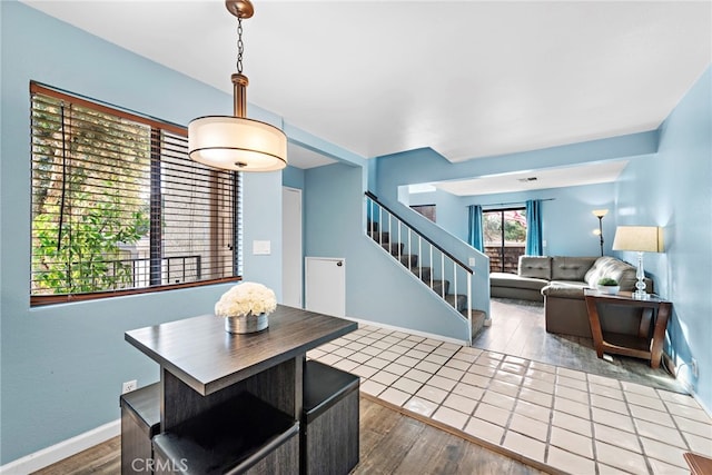 950 W Lambert Rd Unit 9, La Habra, CA 90631 - dining space with baseboards, wood finished floors, and stairway