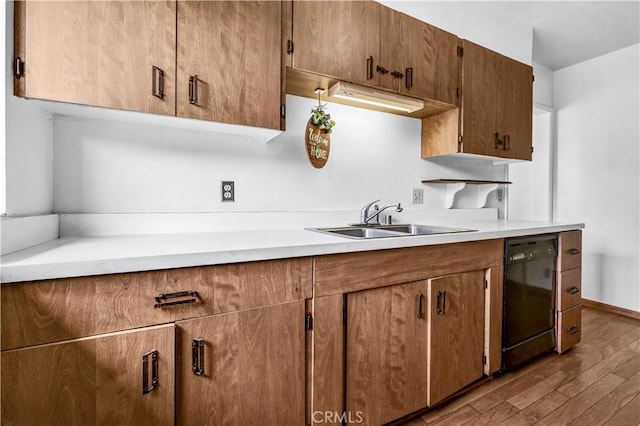 305 Raymondale Dr Unit L, South Pasadena, CA 91030 - kitchen with a sink, light countertops, black dishwasher, and wood finished floors