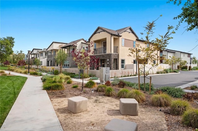 surrounding community with fence and a residential view