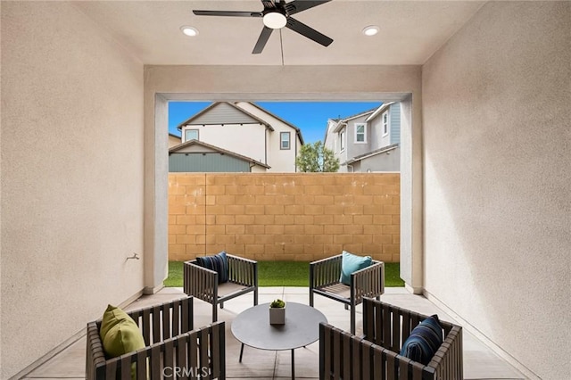 view of patio / terrace with fence, a ceiling fan, and an outdoor hangout area