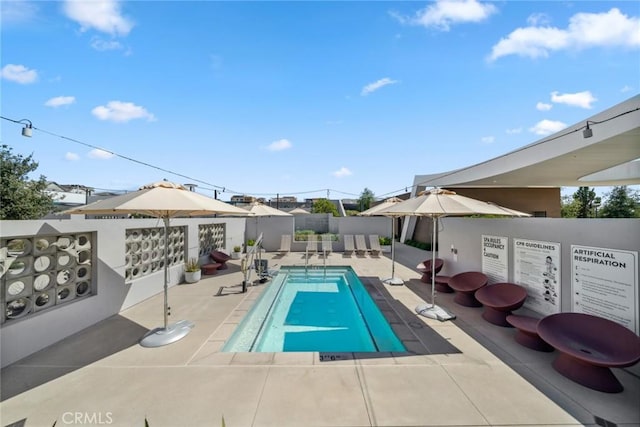 view of pool featuring a fenced backyard, a fenced in pool, and a patio area