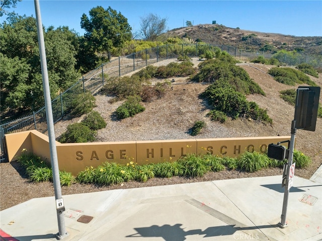 exterior space with fence and a mountain view