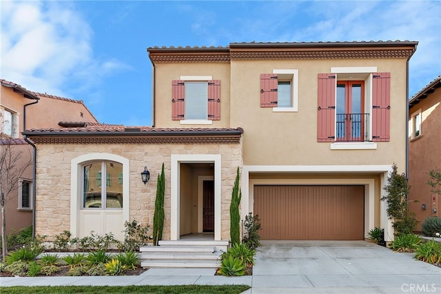 215 Sutters Ml, Irvine, CA 92602 - mediterranean / spanish-style home featuring an attached garage, a tile roof, stone siding, stucco siding, and concrete driveway