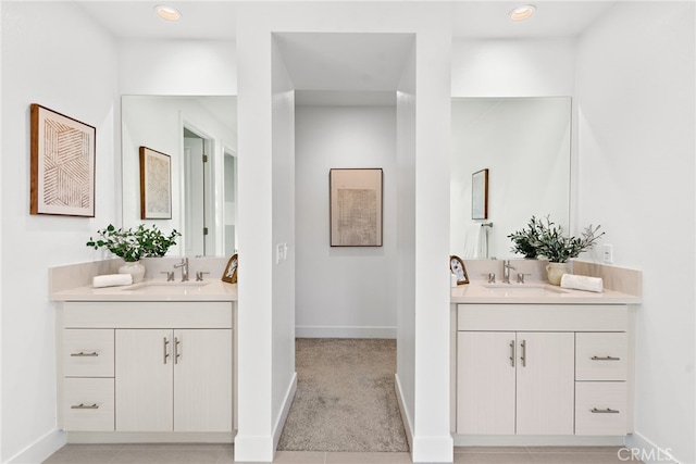 215 Sutters Ml, Irvine, CA 92602 - bathroom featuring a sink, baseboards, and two vanities