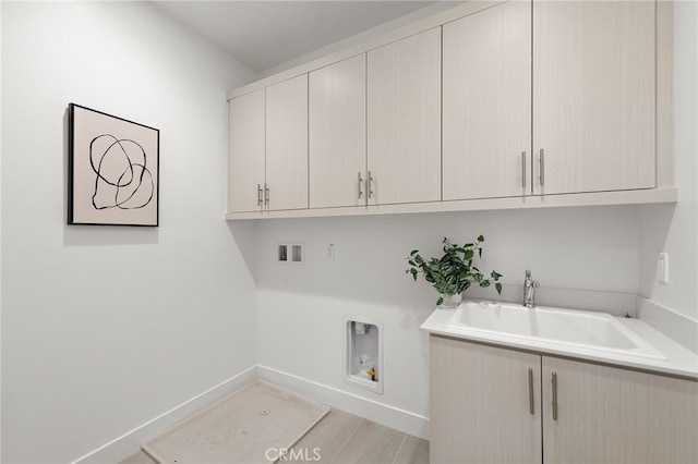 215 Sutters Ml, Irvine, CA 92602 - laundry area featuring washer hookup, hookup for an electric dryer, cabinet space, a sink, and baseboards