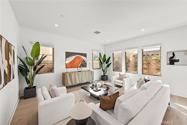 215 Sutters Ml, Irvine, CA 92602 - living area featuring recessed lighting, visible vents, and wood finished floors