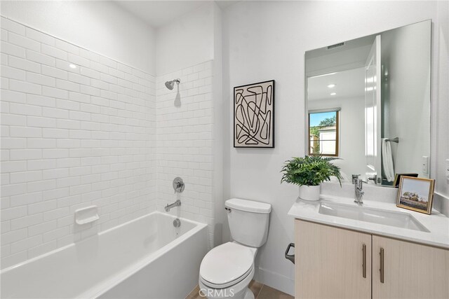 215 Sutters Ml, Irvine, CA 92602 - bathroom featuring visible vents, baseboards, vanity, toilet, and washtub / shower combination